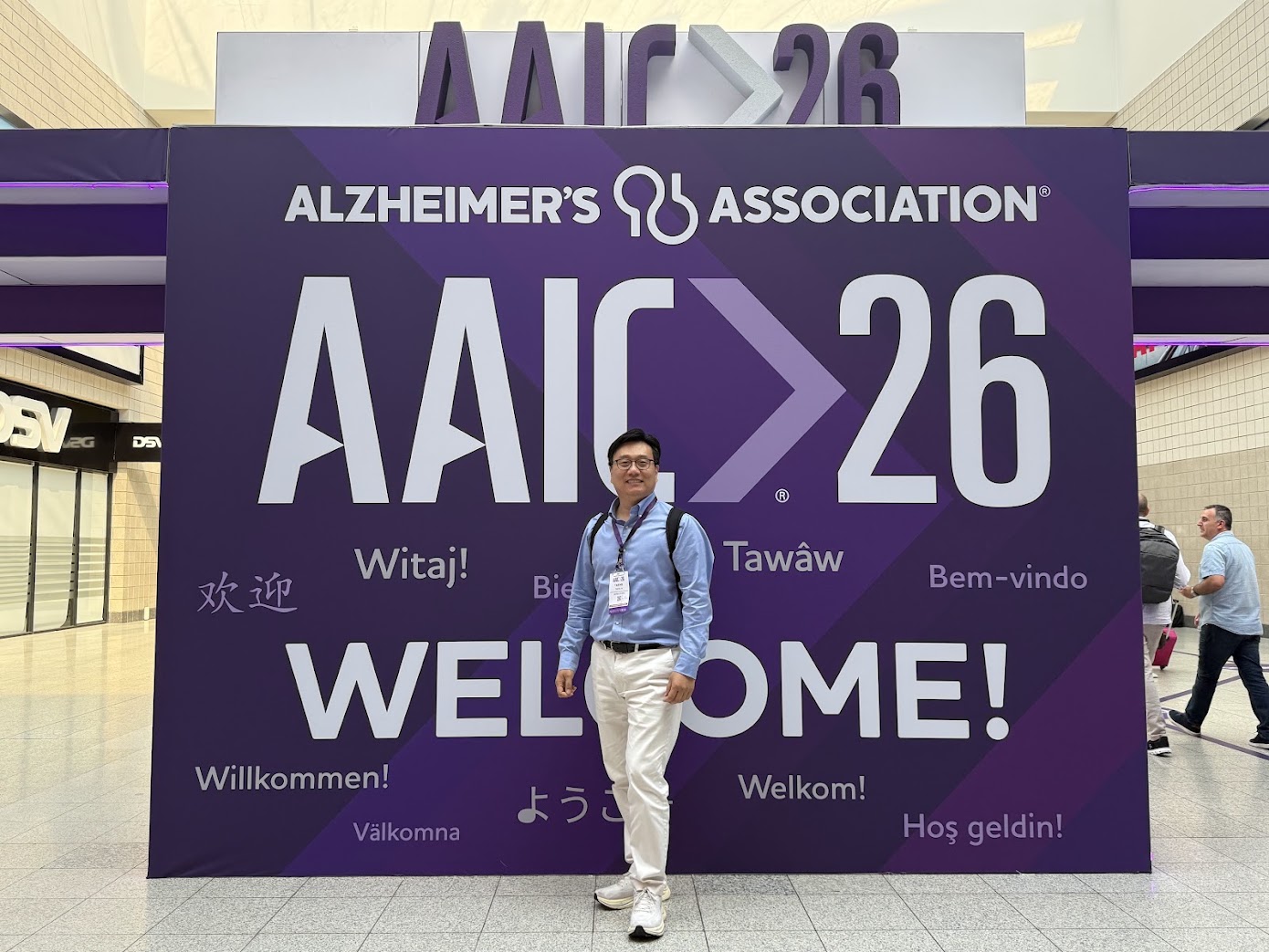 Dr. Taeho Jo at the AAIC 2026 welcome sign in London